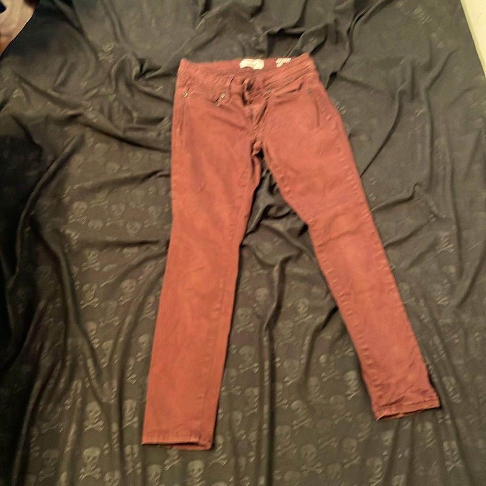 Burgundy colored skinny denim jeans